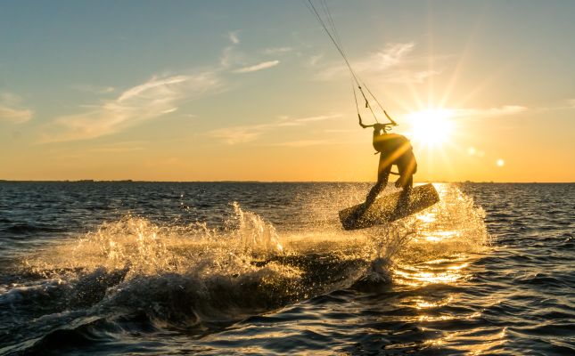 A Person Kite Surfing In The Sea